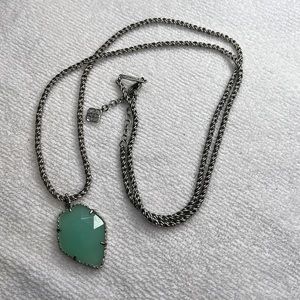 Long Kendra Scott necklace.